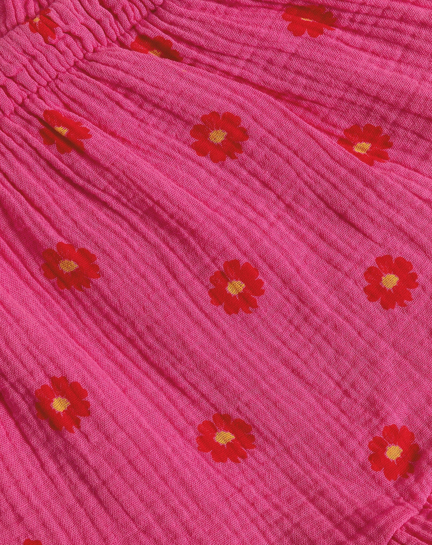 FLOWER MOUSSELINE ONE SLEEVE PLAYSUIT FUCHSIA