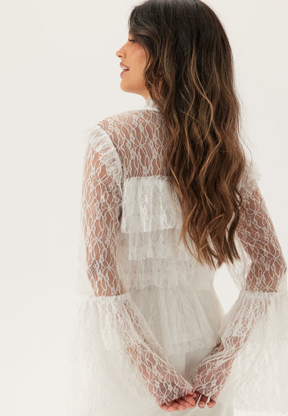 Blusa de encaje con volantes
